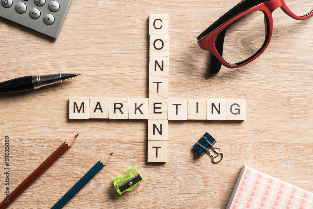 Conceptual business keywords on table with elements of game making crossword Conceptual business keywords on table with elements of game making crossword