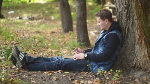 Man Using Laptop in The Park 