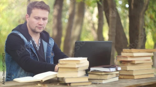 Man Using Laptop in The Park 