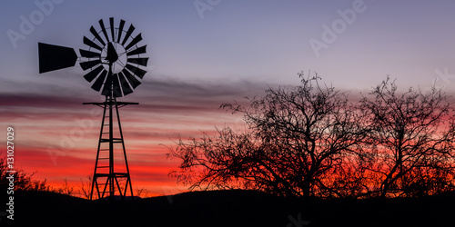 "Arizona Twilight" Traveling to Tombstone, Arizona on a cool December morning.  The silhouette of this windmilll stood out beautifully against the twilight sky.