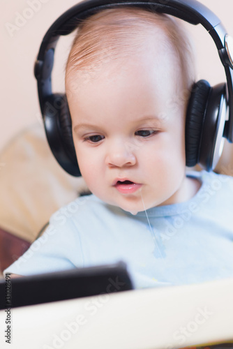 little kid watching a cartoon on the phone