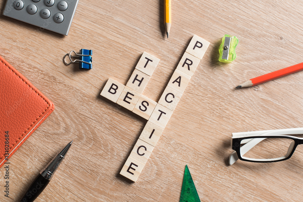Conceptual keywords on wooden table with elements of game making crossword Conceptual keywords on wooden table with elements of game making crossword