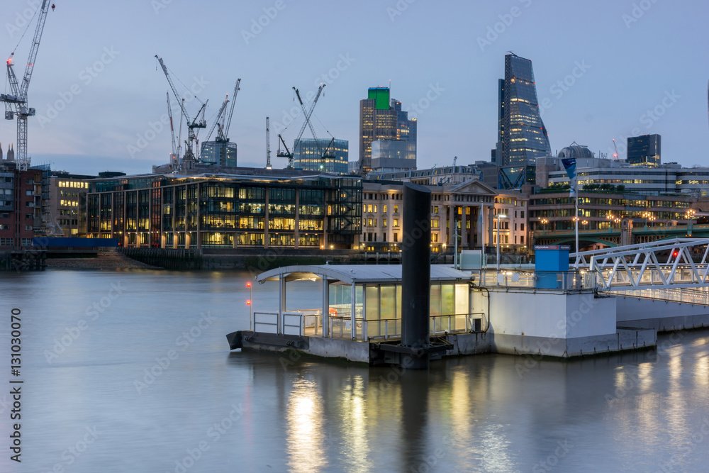 Fototapeta premium LONDON, ENGLAND - JUNE 17 2016: Night Photo of Thames River and skyscrapers, London, Great Britain