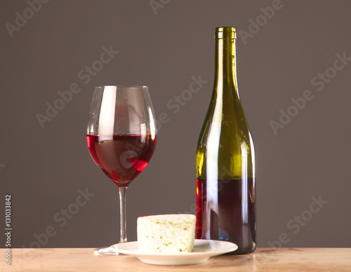 wine bottle and glass on a table