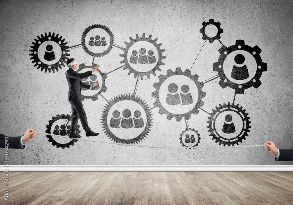 Business concept of risk support and assistance with man balancing on rope Business concept of risk support and assistance with man balancing on rope