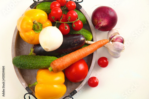 Composition with assorted raw organic vegetables on table