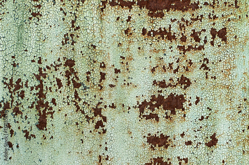 Rusty metal with the paint peeled, old metal corroded surface. Old texture for backgrounds. © eteri
