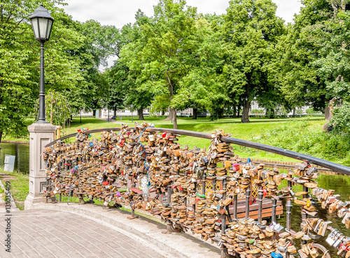 Love padlock wall on the bridge in the park.
 photo