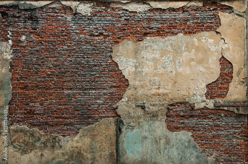 Old brick wall with destroyed stucco. background, texture