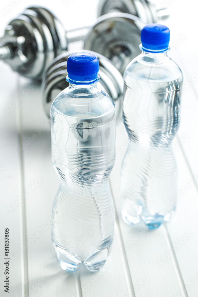 Bottle water and dumbbell. Bottle water and dumbbell.