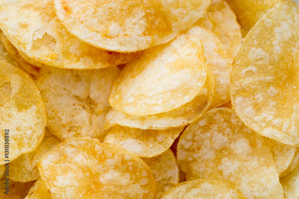 Close up potato chips on wood top view background. Close up potato chips on wood top view background.
