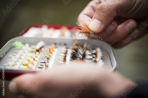 detail of hand with fishing flies photo