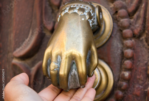 door knocker with hand background , Ancient Knocker door with hand.