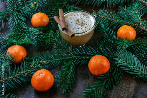 Christmas background with cinnamon sticks, coffee and tangerine