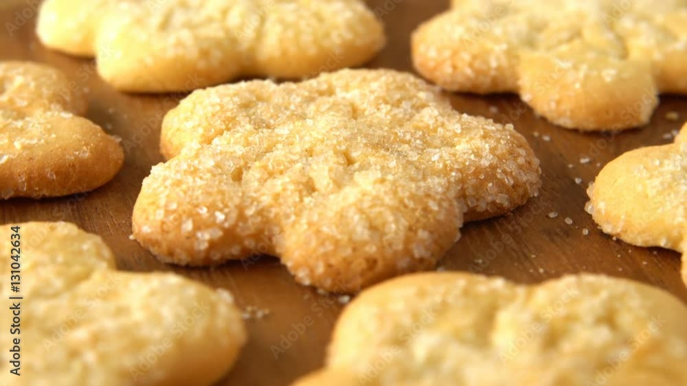 Delicious yummy freshly baked homemade cookies rotating on a wooden board. Looped. Delicious yummy freshly baked homemade cookies rotating on a wooden board. Looped.