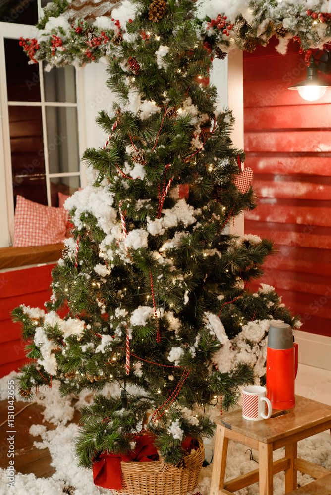 Fototapeta premium Christmas decorations for the house outside with fir tree, snow, and other decoration