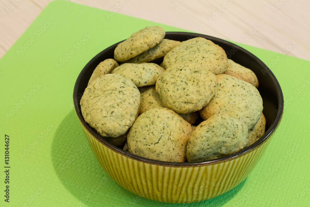 Mint cookies in bowl on green napkin. 