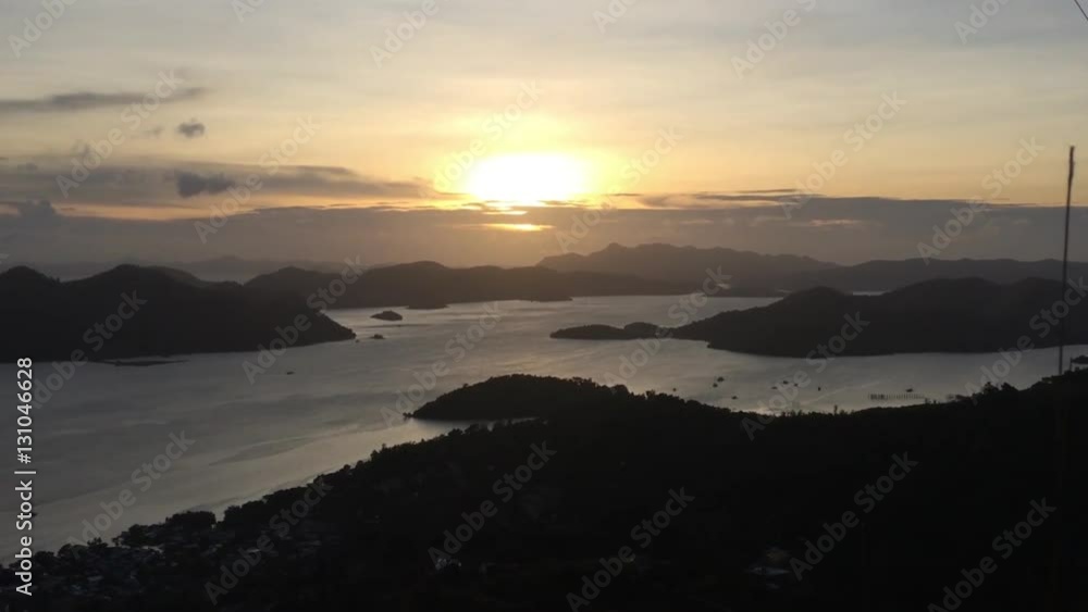 View on beautiful sunset on a tropical island in the sea by Coron in Philippines, Busuanga. View on beautiful sunset on a tropical island in the sea by Coron in Philippines, Busuanga.