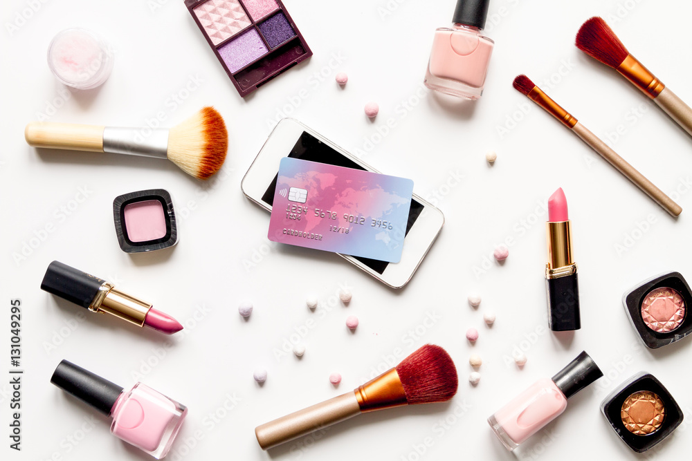 concept online shopping cosmetics on white background top view concept online shopping cosmetics on white background top view