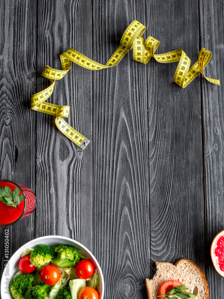 concept slimming diet fresh vegetables on wooden background top view