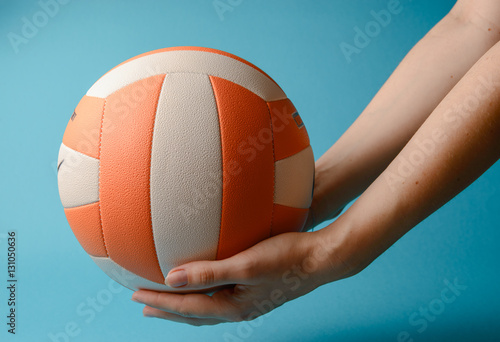 Volleyball in woman hands