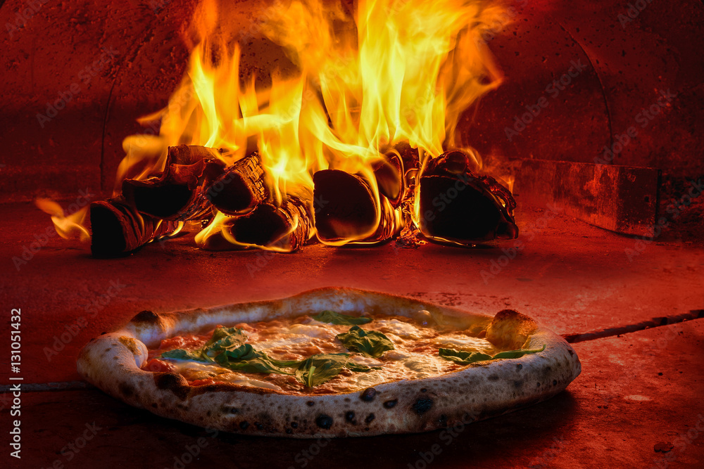 Italian pizza making dough stretching olive oil mozzarella cheese wood fire oven