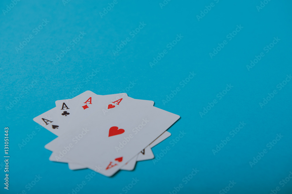 A winning poker hand of four aces playing cards A winning poker hand of four aces playing cards