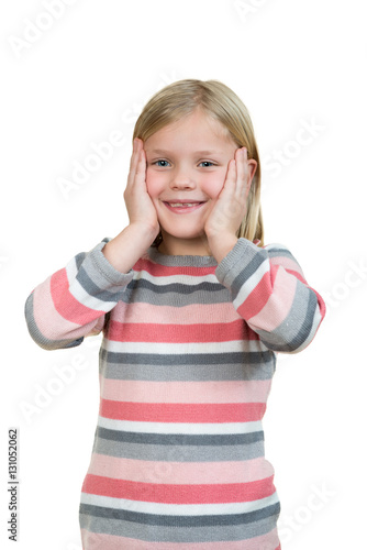 Cute girl is holding her face in astonishment and looking up, isolated over white