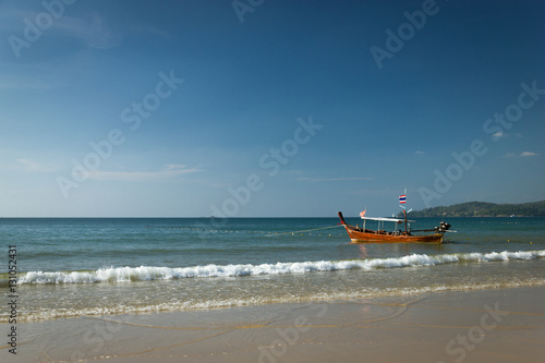 One boat docked on a beach