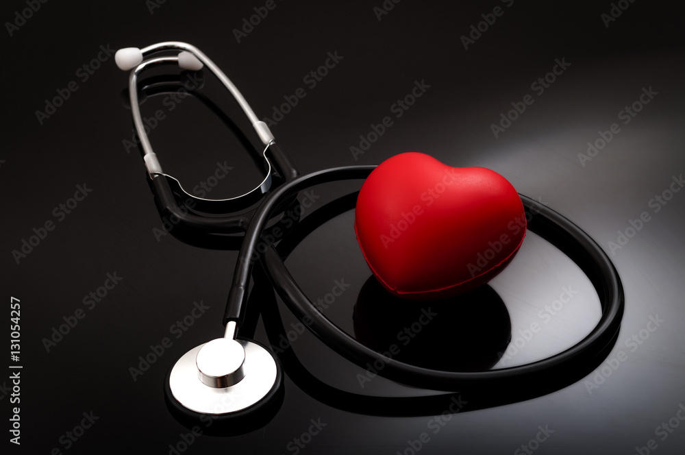 Stethoscope and heart for blood pressure check up on black background Stock  Photo | Adobe Stock
