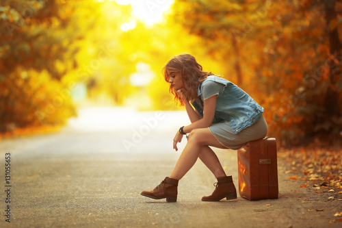Beautiful young woman sitti...