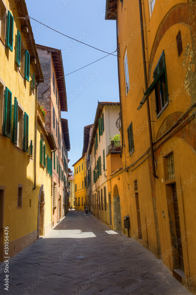 Fototapeta premium alley with old buildings in Lucca, Italy
