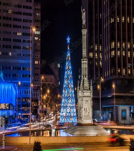 Hyperlapse of lighting Christmas tree at Colon square in Madrid city photo