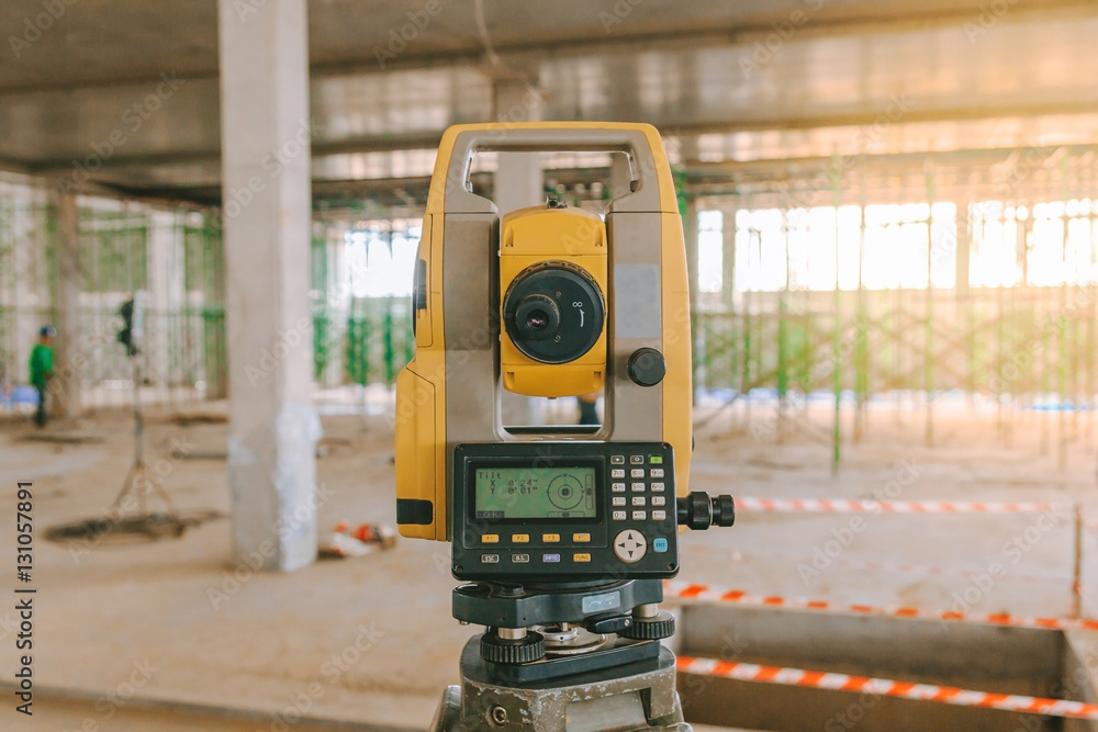 Surveyor equipment tacheometer or theodolite outdoors at construction site