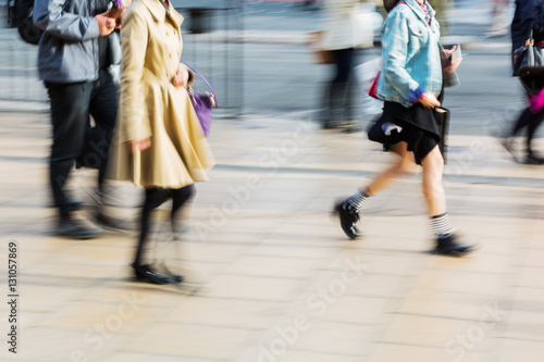 pedestrians on the sidewalk in the city