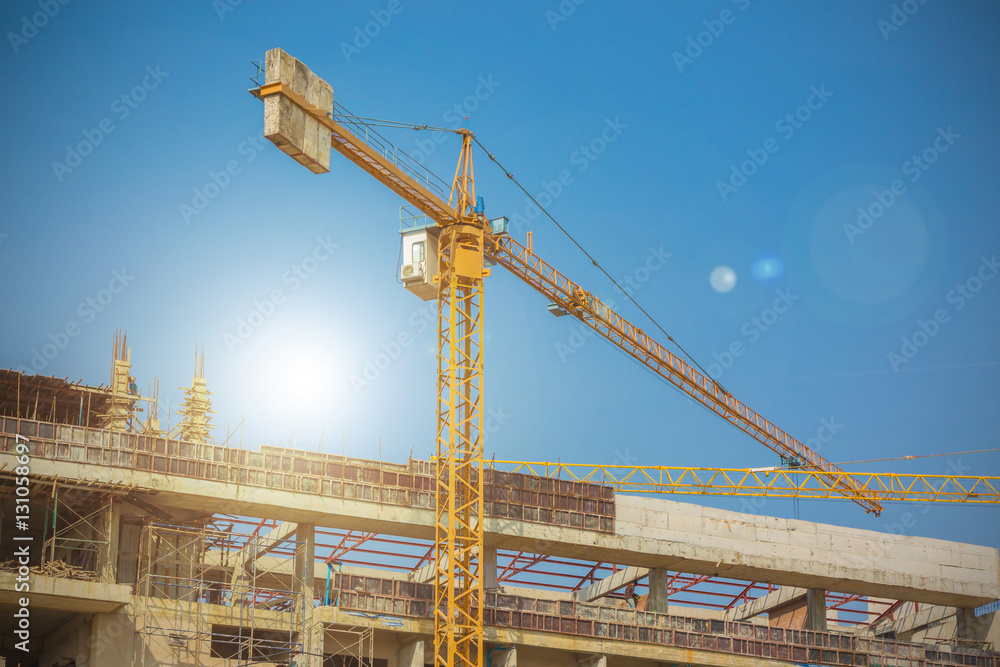 construction crane, building and blue sky. construction crane, building and blue sky.