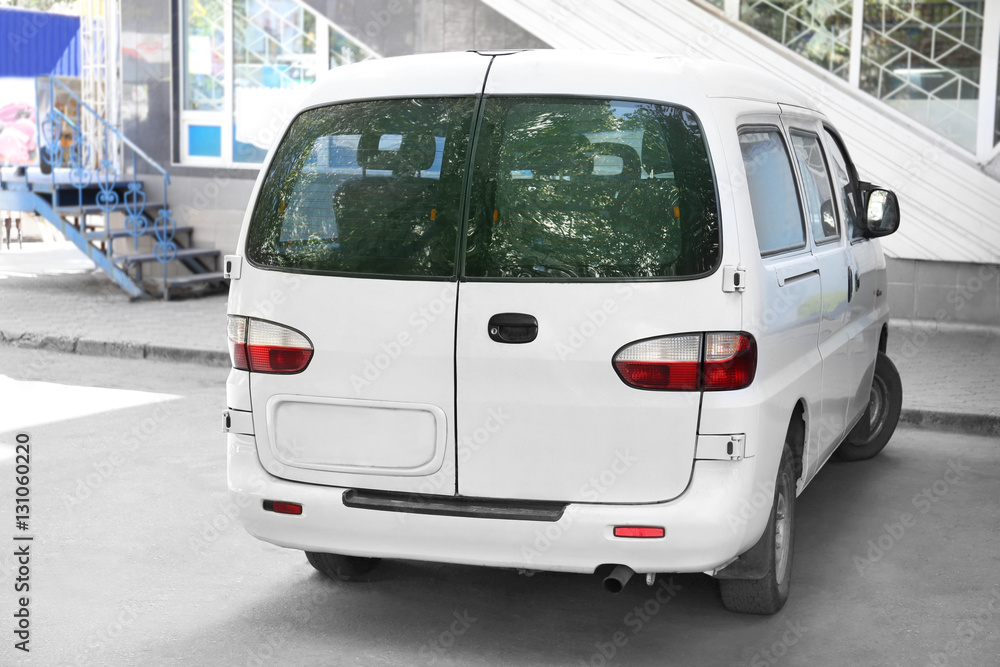 White delivery car in the yard