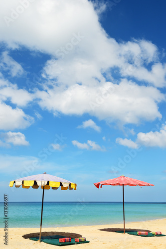 Beautiful sandy beach with umbrella  © thananya_k