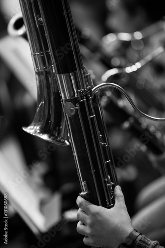 Detail of contrabassoon in the orchestra closeup in black and white photo