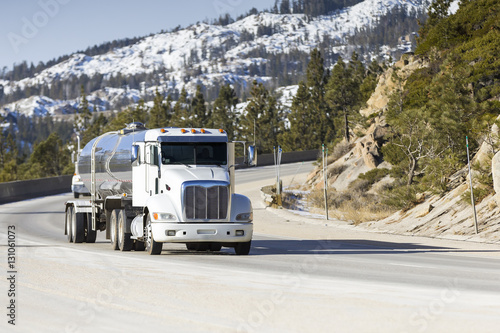 Tanker Big Rig Semi Truck on Snowy Mountain Pass