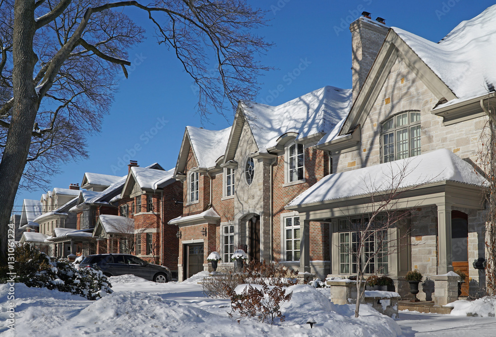 suburban street on a sunny day after a snow storm