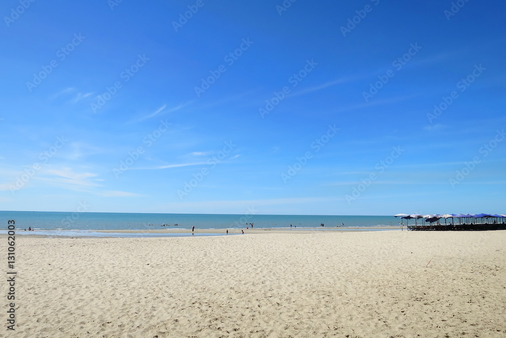 The beautiful beach with blue sky and beach chairs, Cha-um, Thailand.