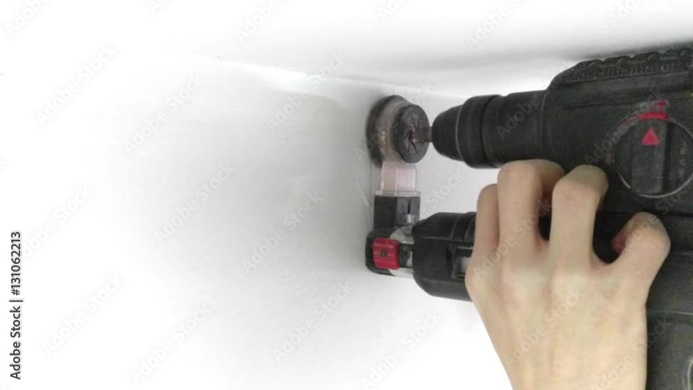 I am masonry drill a hole with an electric drill.