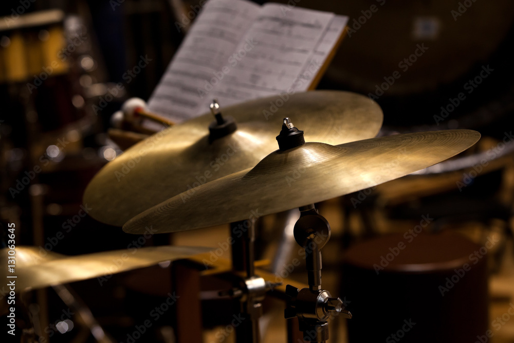 Fototapeta premium Orchestral cymbals closeup in dark colors