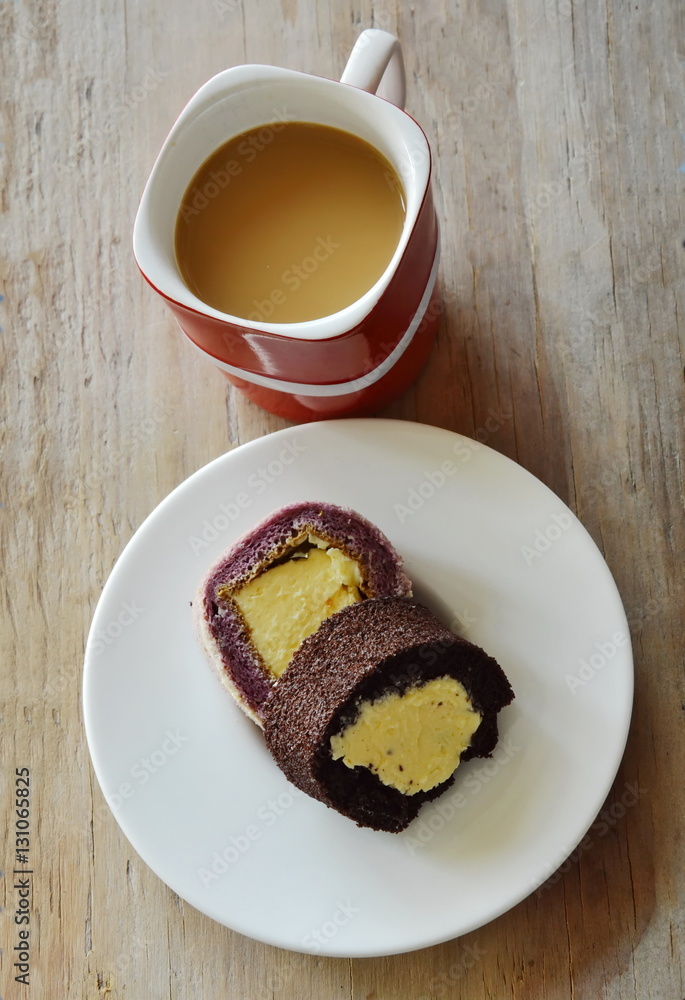 chocolate and grape cake roll stuffed cream eat couple with coffee in red cup chocolate and grape cake roll stuffed cream eat couple with coffee in red cup