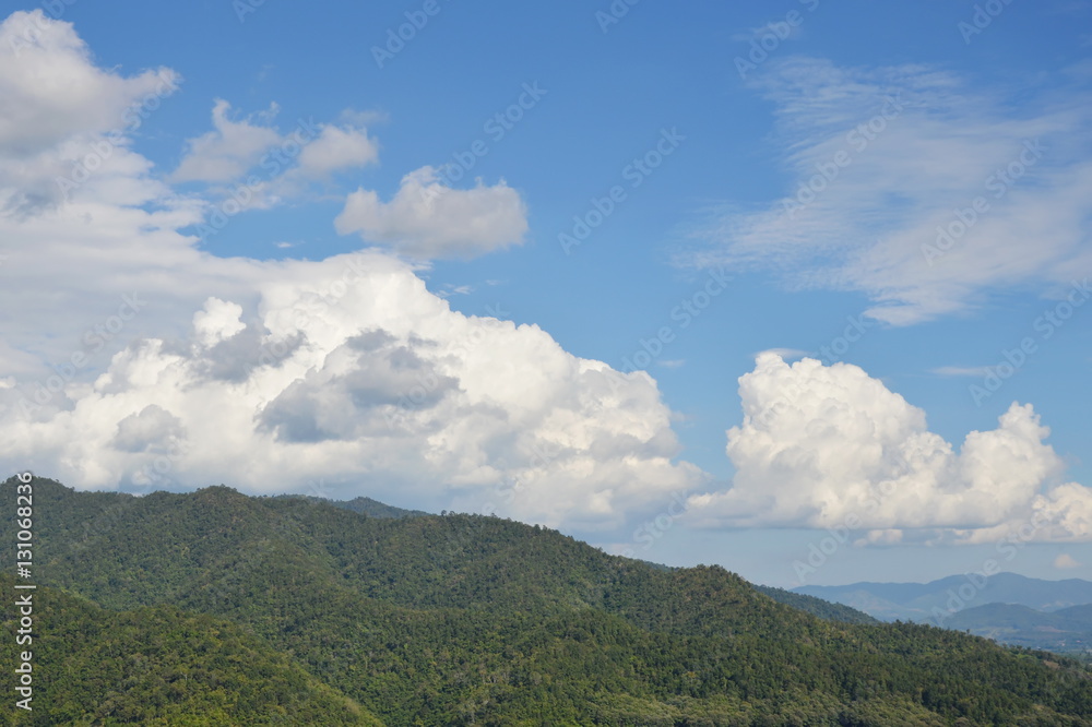 mountain slope and cloudy background in sunshine day