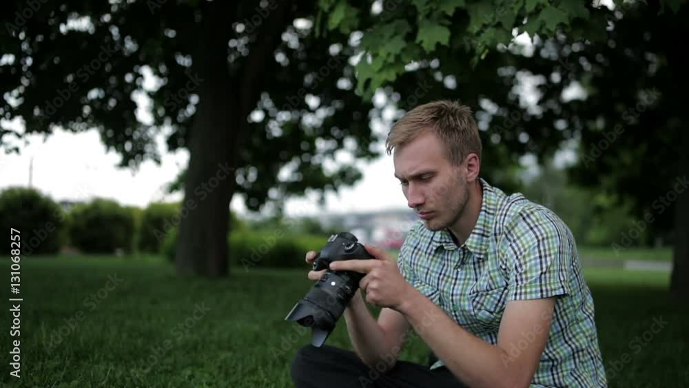 Man sets the camera before taking a picture with your smartphone Man sets the camera before taking a picture with your smartphone