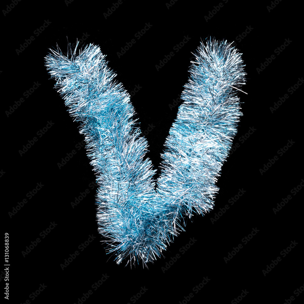 Festive alphabet made of blue tinsel. Letter V on black background. Isolated Festive alphabet made of blue tinsel. Letter V on black background. Isolated