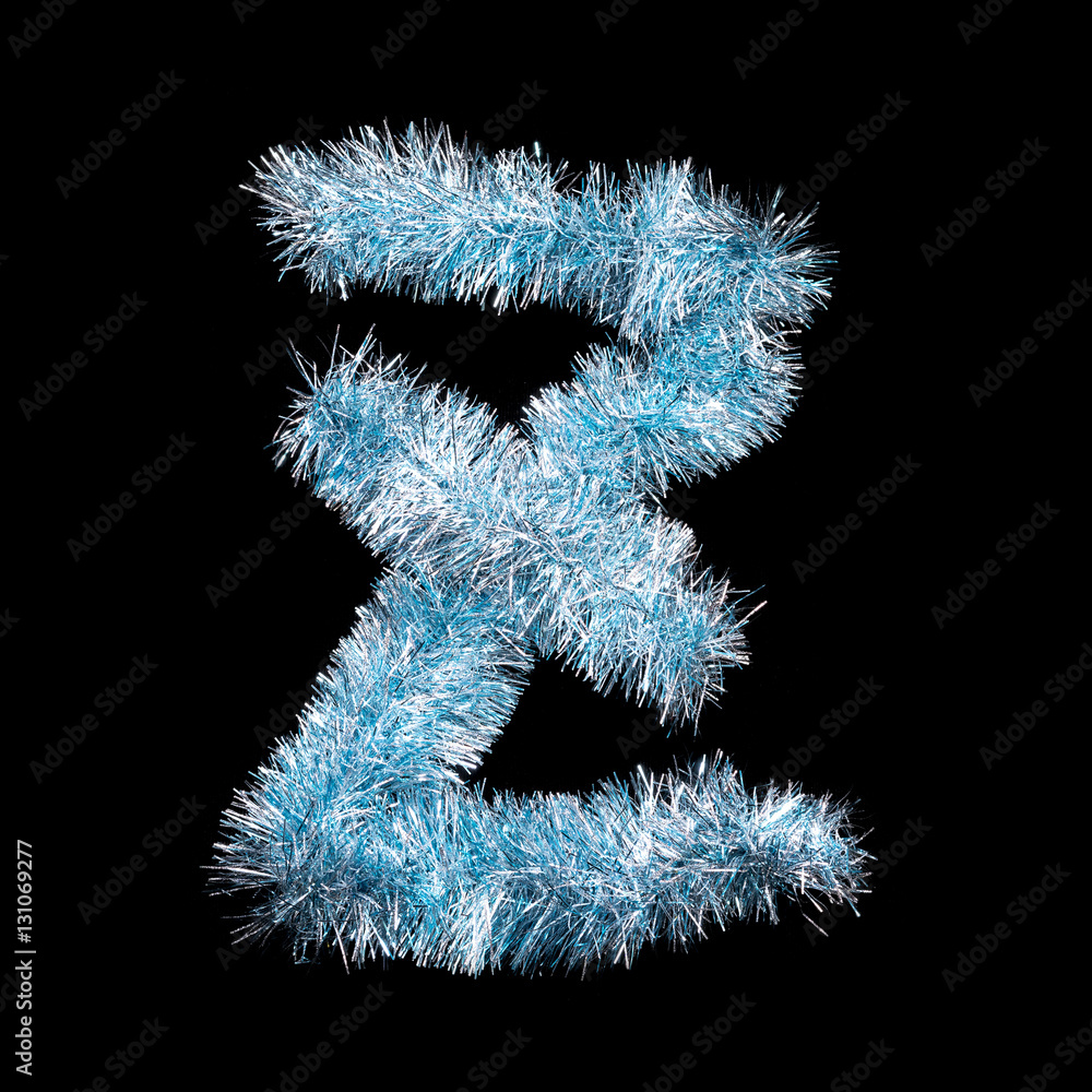 Festive alphabet made of blue tinsel. Letter Z on black background. Isolated Festive alphabet made of blue tinsel. Letter Z on black background. Isolated