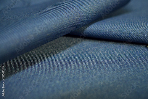 close up roll texture denim blue fabric of suit